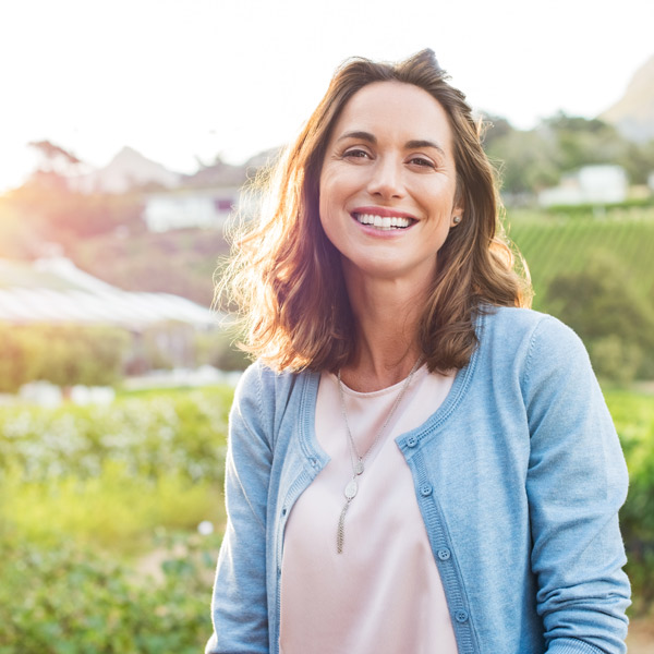 woman smiling over field