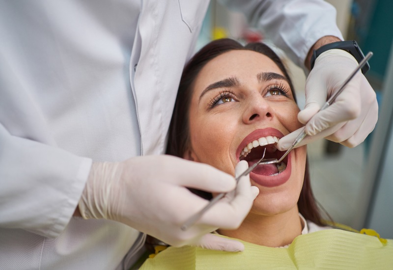Reiser Dental is providing general dentistry treatment to a woman in Denver, CO