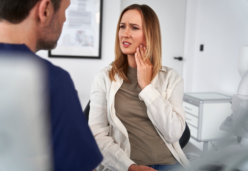A woman is getting bruxism treatment by Reiser Dental in Denver, CO